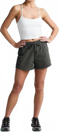 Beyond Yoga Peak Mid Rise Shorts In Slate Green