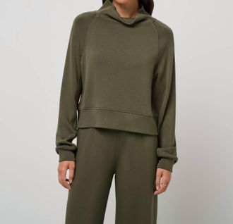 Travis Mathew Skyloft Soft Funnel Neck Top In Grape Leaf