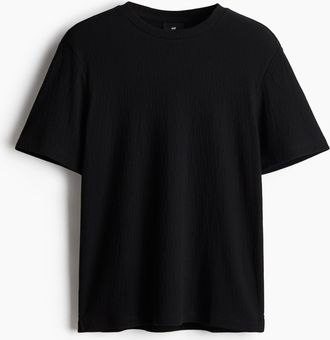 H&M T-Shirt mit Struktur in Regular Fit - Schwarz