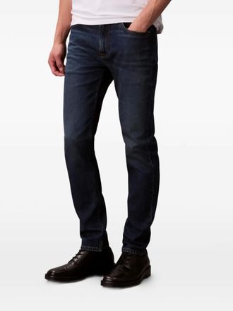 Calvin Klein five-pockets logo-patch jeans - men - Fabric - 33/32 - Blue