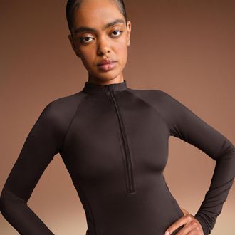 Nike Womens SKIMS Shine Long-Sleeve Half-Zip Top in Brown | TPZUP7350W-PHO