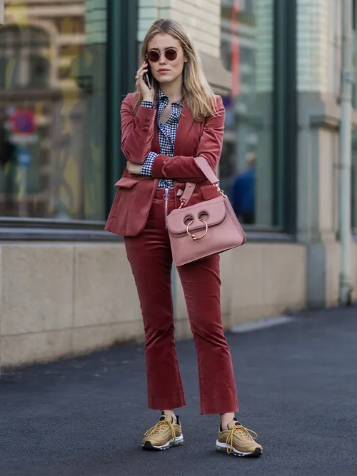 pink velvet suit and pink bag