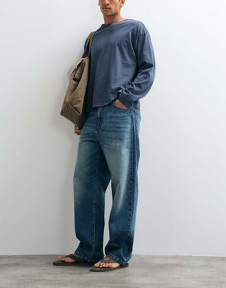 Carhartt Work in Progress jeans Landon loose tapered fit con effetto schizzi di vernice in lavaggio blu sporco
