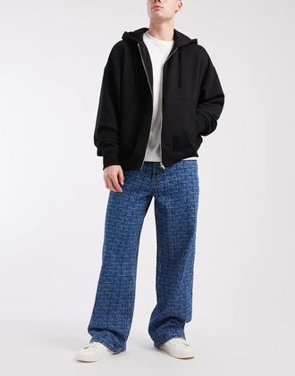 Tommy Jeans Theo - Jeans ampi lavaggio blu medio con stampa ripetuta