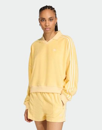 adidas Originals Polo a maniche lunghe in spugna arancione con scollo a V
