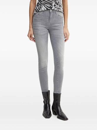 A|X Armani Exchange logo-plaque skinny jeans - women - Polyester/Elastane/Cotton - 24/32 - Grey