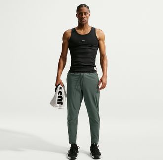 Nike Mens Unlimited Dri-FIT Zippered Cuff Versatile Pants in Green | FB7548-303