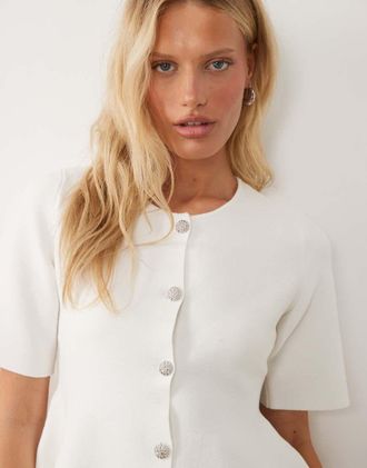 Vila Top a maniche lunghe bianco strutturato in maglia con fondo peplo