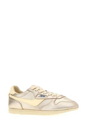 Autry Womens Gold Leather Windspin Sneakers Lamlealeaplatrut