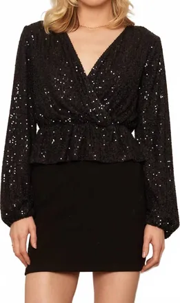 En Cr&egrave;me Long Sleeve Peplum Sequin Top In Black