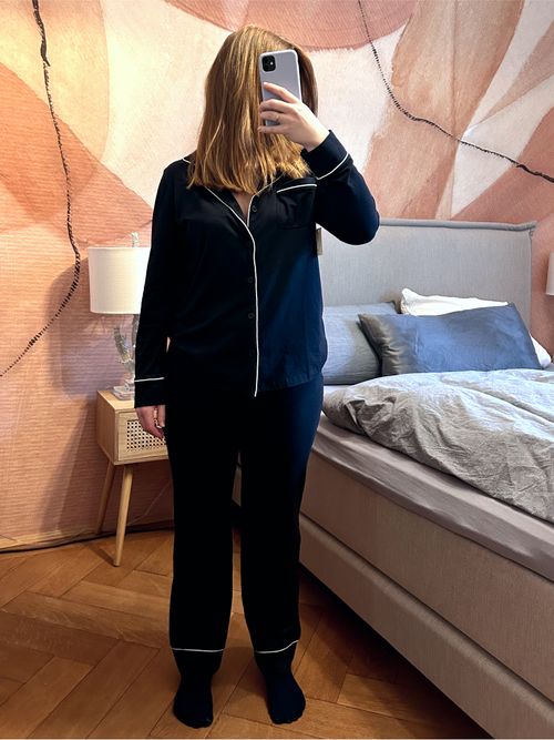 Our style editor wears the black and white long sleeve pajama set from Amazon