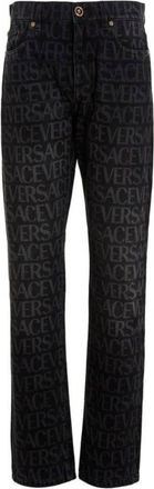 Versace All-Over Logo Denim Jeans