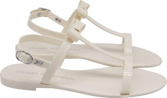 Stuart Weitzman Mellie Bow Jelly Flat Sandals In White Rubber