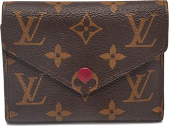 Louis Vuitton Portafoglio Victorine in tela cerata - Marrone