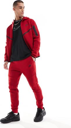 Nike Tech Fleece cuffed sweatpants in red