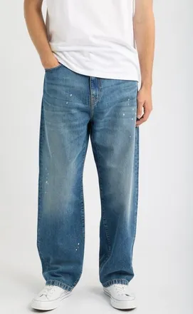 Carhartt Work in Progress Landon Tapered Leg Jeans in Blue (Destroy Wash/splatter) at Nordstrom, Size 38