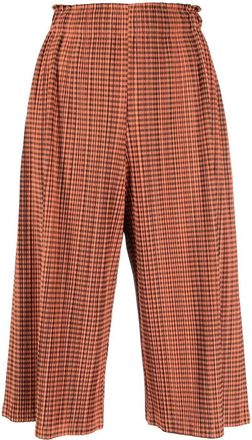 Issey Miyake 2000s pleated cropped trousers - women - Polyester - S - Orange