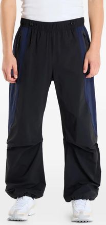 Nike Pantaloni sportivi oversize con design color-block - Nero