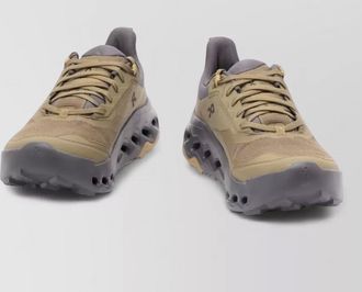 On perforated low-top sneakers