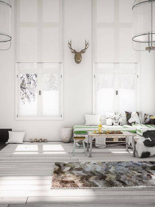 Ein rustikal modernes Wohnzimmer in weiß mit Pallettencouch und Kamin.