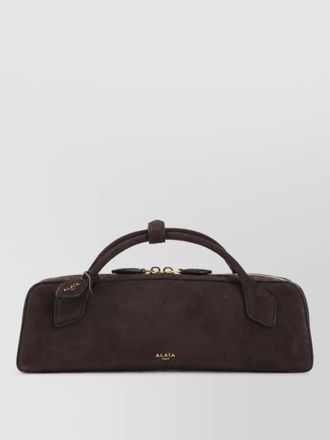 Alaia leather clutch bag