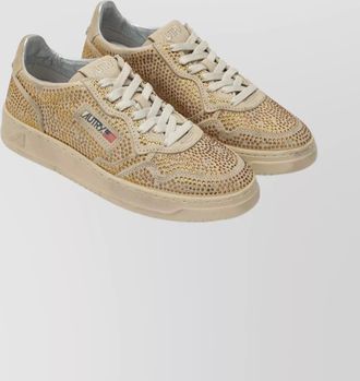 Autry sneakers featuring embellished accents and rubber sole