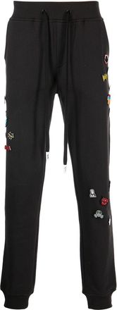 Haculla decorative-pin detail track pants - men - Cotton - M - Black