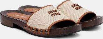 Miu Miu Mules in canvas con pelle