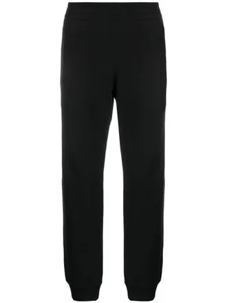 Moschino logo-patch elasticated track pants - men - Organic Cotton - 52 - Black