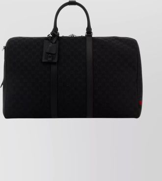 Gucci travel bag with embossed design and tag
