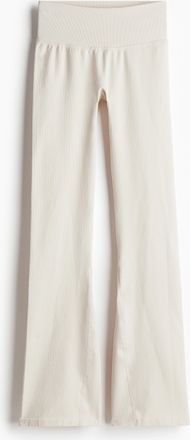 H&M Ausgestellte Seamless Sportleggings mit DryMove - Beige