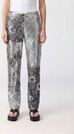 Maison Margiela Pantaloni a gamba larga a vita bassa con paillettes floreali