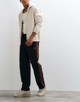 adidas Originals pantaloni della tuta Firebird marrone e arancione bruciato
