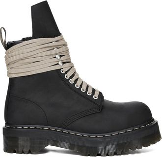 Dr. Martens Robust Black Leather Quad Sole Boots With Steel Toe Design