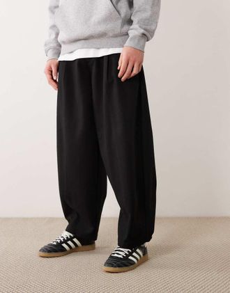 Asos Pantaloni eleganti bombati a pieghe con fondo ampio in misto lana neri a spina di pesce-Nero