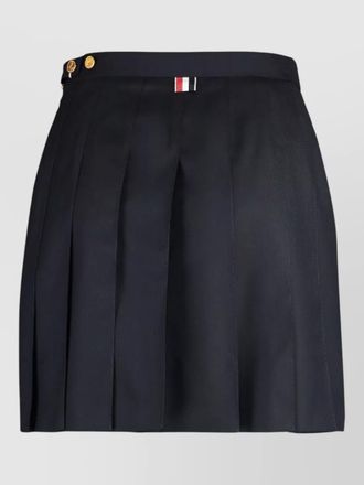 Thom Browne pleated skirt asymmetric hem gold buttons