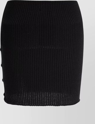 Courrèges skirts featuring button detailing and elastic waistband