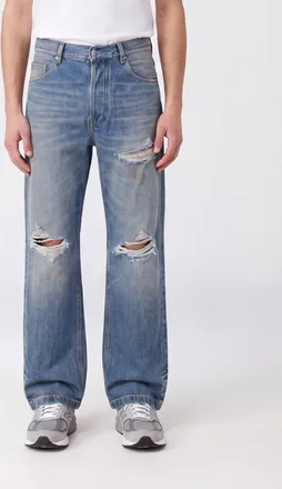 Amiri Jeans wide leg in denim distressed con effetto usurato