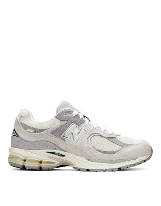 New Balance 2002 - Sneakers in bianco sporco e grigio