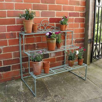 Melody Maison Sage Green Metal Three Tier Plant Theatre Stand in Dark Blue