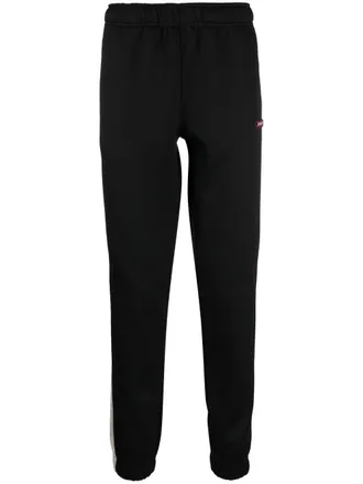 Diesel logo-patch tapered track pants - men - Polyester/Spandex/Elastane - L - Black