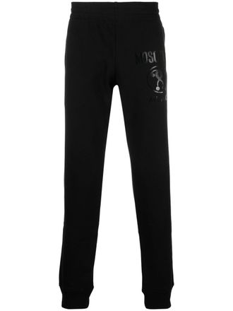 Moschino logo-print track pants - men - Organic Cotton - 50 - Black