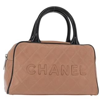 Chanel Embossed Logo Bowler Quilted Caviar Beige Leather Handbag (Pre-Owned)