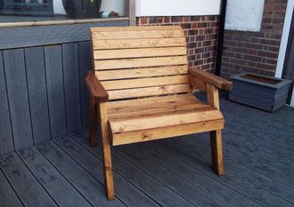 Charles Taylor Trading Solid Wood Grand Chair in Brown
