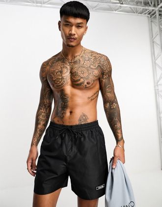 Calvin Klein Pantaloncini da bagno neri con coulisse e nastro con logo-Nero