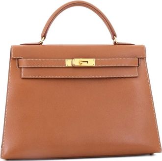 Herm&egrave;s Borsa a mano Kelly 32 in pelle Courchevel con tracolla e dettagli color oro - Marrone