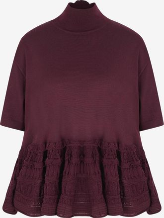 Alaia Top mit Stehkragen aus Schurwolle Peplum