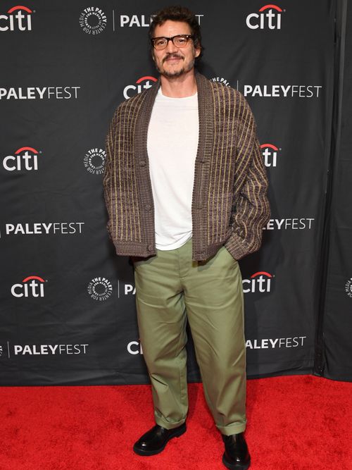 At the 2023 edition of PaleyFest LA, Pedro wore rimmed glasses, an oversized brown cardigan, a white t-shirt, olive green baggy chinos, and black derbys.