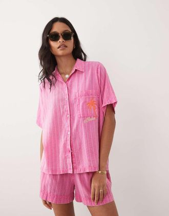 Rip Curl Camicia da mare a maniche corte rosa acceso a righe in coordinato