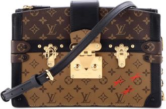 Louis Vuitton Trunk Reverse canvas clutch met monogram - Bruin